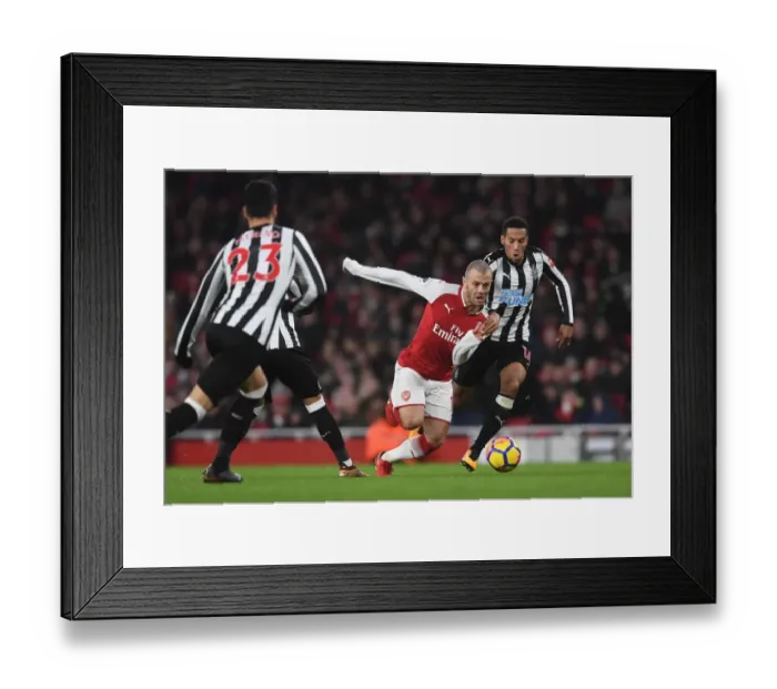 Framed Print : Arsenal's Jack Wilshere Clashes with Newcastle's Isaac Hayden in Premier League Showdown Framed Print : Arsenal's Jack Wilshere Clashes with Newcastle's Isaac Hayden in Premier League Showdown