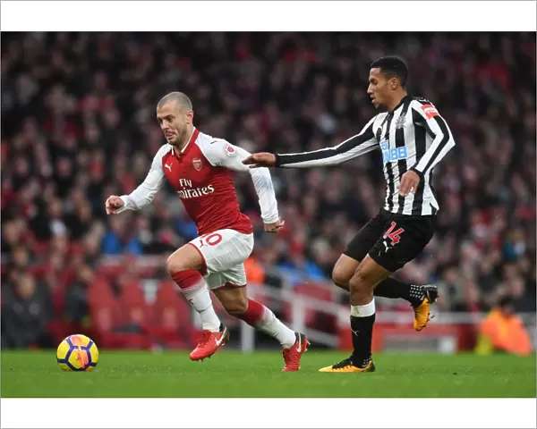 Intense Rivalry: Wilshere vs. Hayden Clash in Arsenal vs. Newcastle Football Match