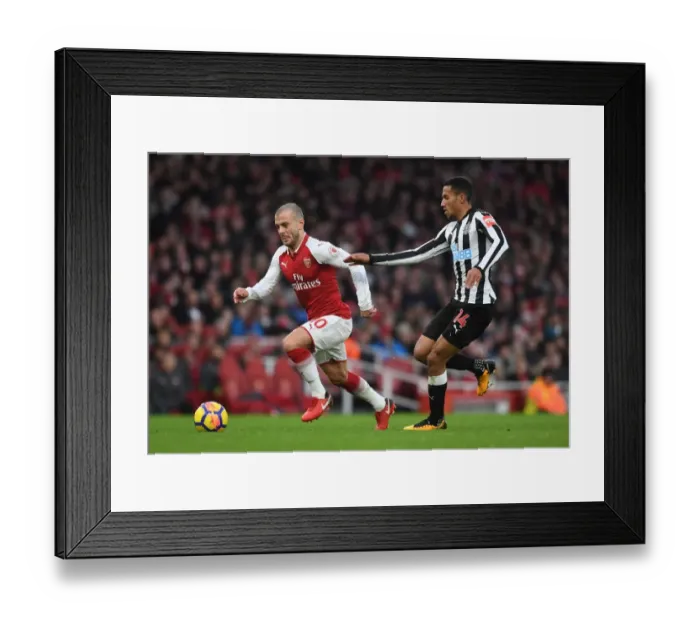 Framed Print : Intense Rivalry: Wilshere vs. Hayden Clash in Arsenal vs. Newcastle Football Match