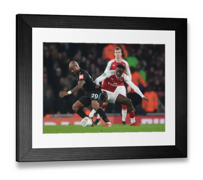 Framed Print : Arsenal vs. West Ham: Dasilva Tackles Ayew in Carabao Cup Showdown