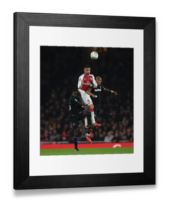 Framed Print : Coquelin vs. Ayew and Quina: A Headed Battle in the Carabao Cup Clash between Arsenal and West Ham
