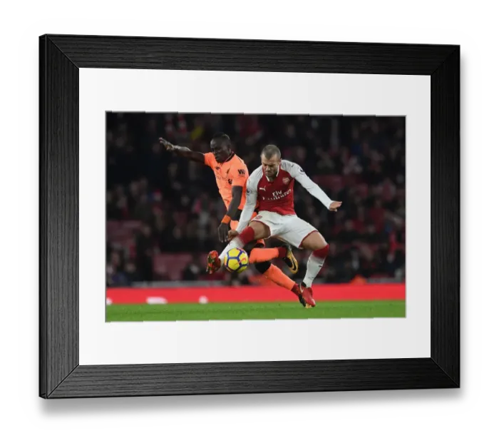 Framed Print : Clash of Talents: Wilshere vs Mane in Arsenal v Liverpool Showdown