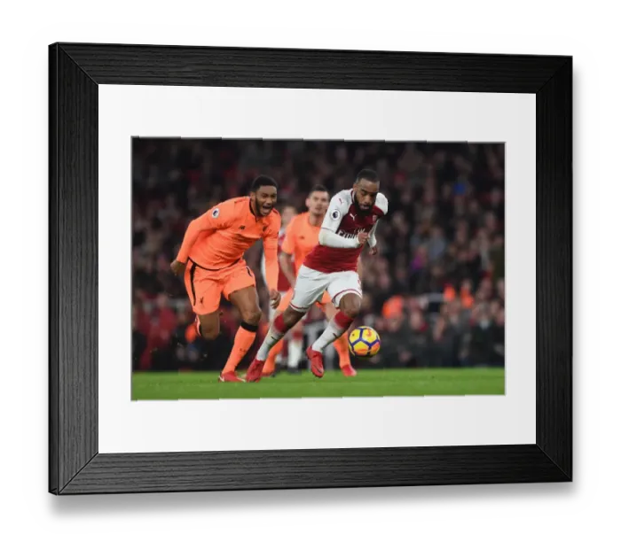 Framed Print : Arsenal's Alexandre Lacazette Clashes with Liverpool's Joe Gomez in Premier League Showdown