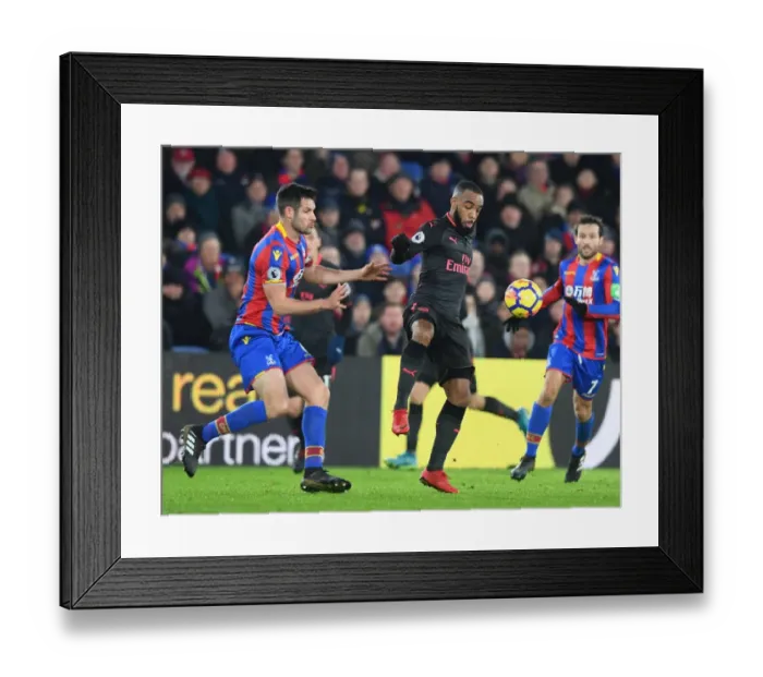 Framed Print : Arsenal's Lacazette and Crystal Palace's Dann Clash in Intense Premier League Showdown Framed Print : Arsenal's Lacazette and Crystal Palace's Dann Clash in Intense Premier League Showdown