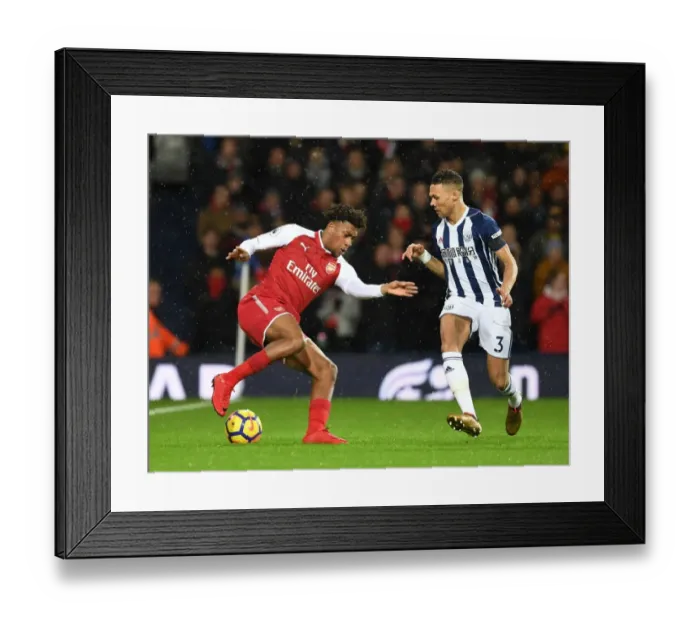 Framed Print : Arsenal's Alex Iwobi Fends Off West Brom's Kieran Gibbs Framed Print : Arsenal's Alex Iwobi Fends Off West Brom's Kieran Gibbs