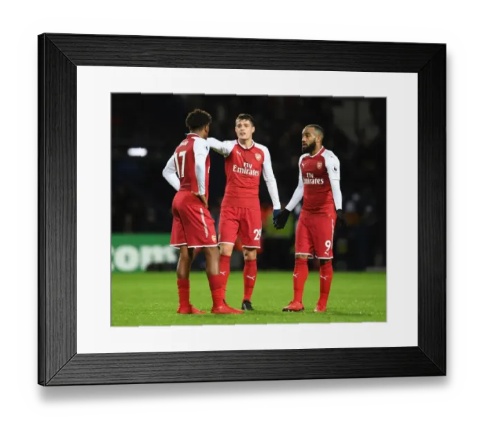 Framed Print : Deep in Thought: Lacazette, Iwobi, and Xhaka's Intense Discussion on the Arsenal Sideline