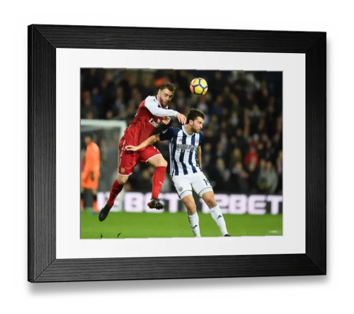 Framed Print : Calum Chambers vs Jay Rodriguez: A Tense Heading Duel in Arsenal's Premier League Battle with West Bromwich Albion (2017-18)