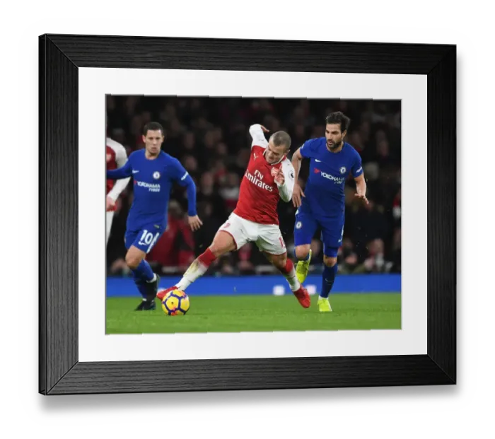 Framed Print : Wilshere Outsmarts Fabregas: Epic Battle Between Former Arsenal Teammates in Premier League Clash