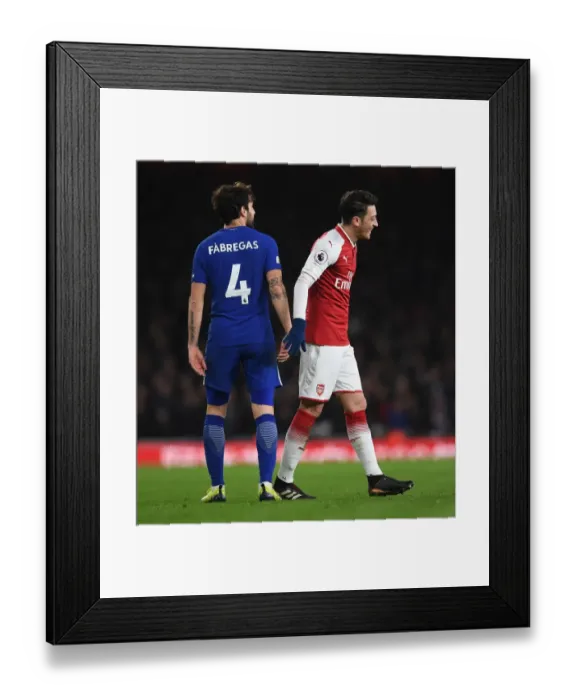 Framed Print : Mesut Ozil and Cesc Fabregas Share a Light-Hearted Moment Amidst Rivalry: Arsenal vs. Chelsea, Premier League 2017-18