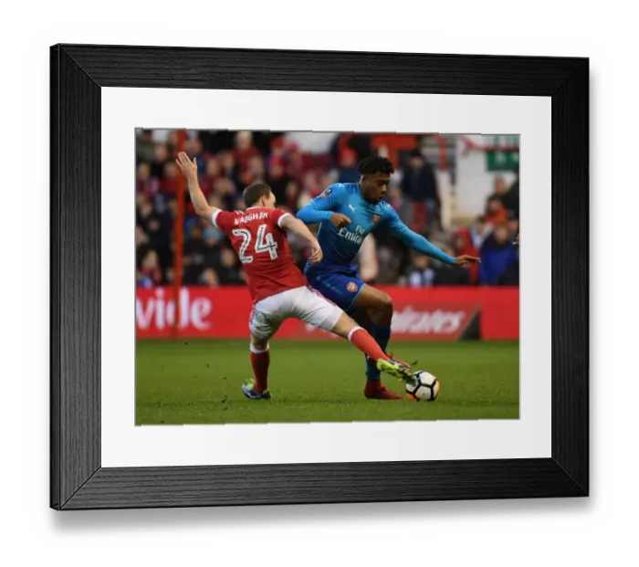 Framed Print : Arsenal's Alex Iwobi Outmaneuvers Nottingham Forest's David Vaughan in FA Cup Clash Framed Print : Arsenal's Alex Iwobi Outmaneuvers Nottingham Forest's David Vaughan in FA Cup Clash
