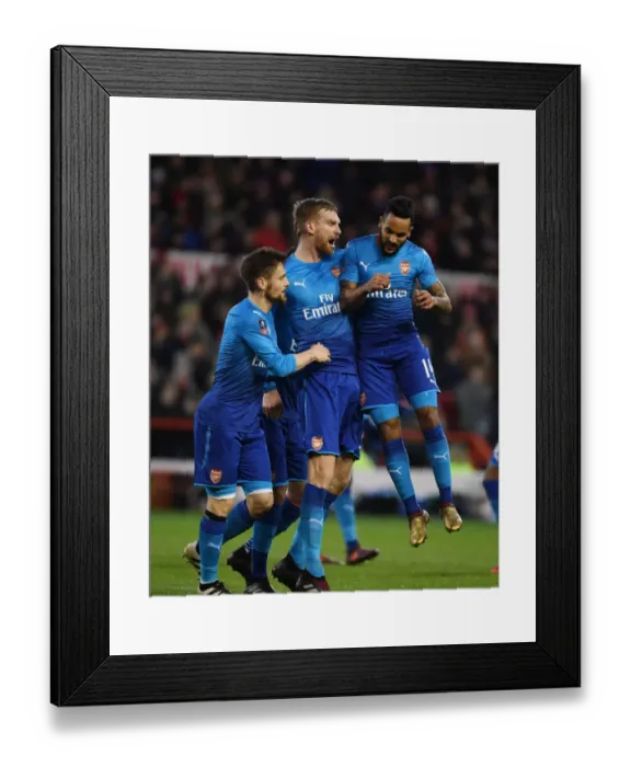 Framed Print : Per Mertesacker, Debuchy, and Walcott's Goal Celebration: Arsenal Triumphs Over Nottingham Forest in FA Cup Third Round