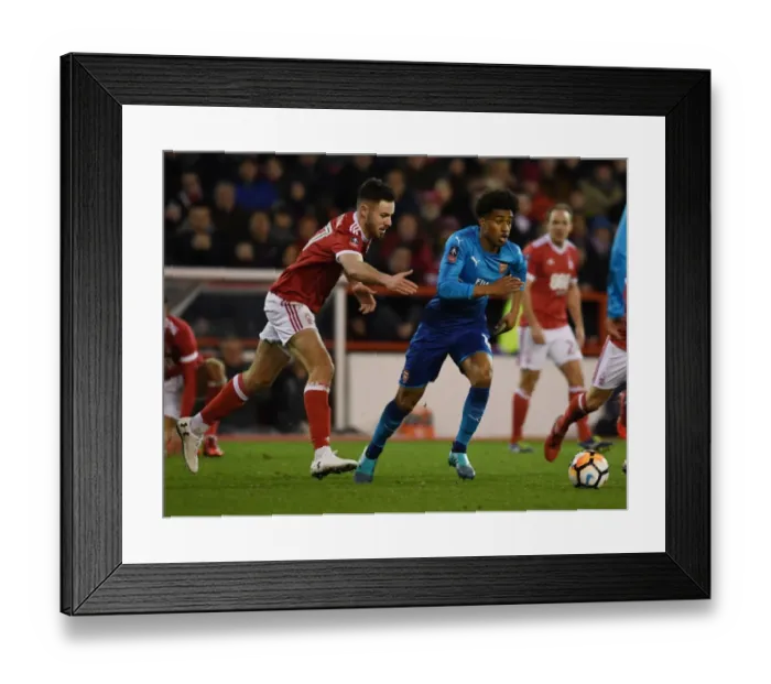 Framed Print : Reiss Nelson Outmaneuvers Ben Brereton: Nottingham Forest vs Arsenal - FA Cup Third Round