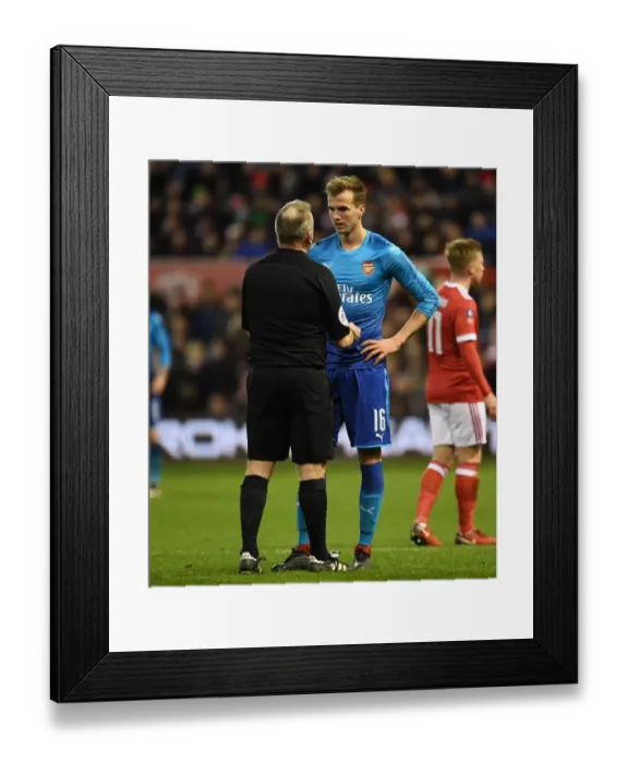 Framed Print : Rob Holding in Deep Conversation with Referee John Moss during Nottingham Forest vs Arsenal FA Cup Clash Framed Print : Rob Holding in Deep Conversation with Referee John Moss during Nottingham Forest vs Arsenal FA Cup Clash
