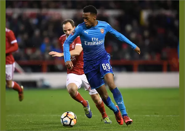 Arsenal's Joe Willock Brushes Past Nottingham Forest's David Vaughan in FA Cup Clash