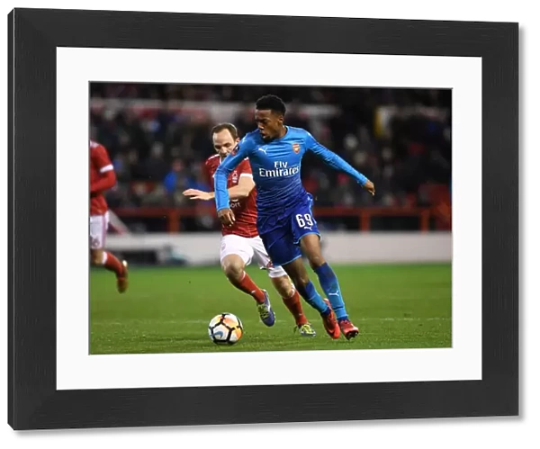 Arsenal's Joe Willock Brushes Past Nottingham Forest's David Vaughan in FA Cup Clash