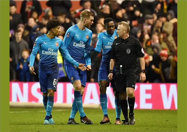 Arsenal's Disputed Penalties: Nelson, Welbeck, and Mertesacker Argue with Ref during Nottingham Forest FA Cup Match