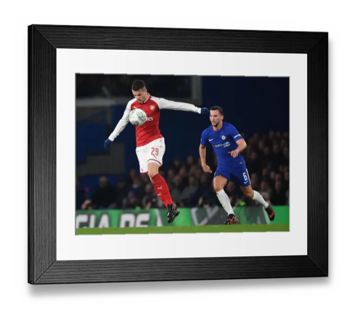 Framed Print : Granit Xhaka vs. Danny Drinkwater: Carabao Cup Semi-Final Showdown at Stamford Bridge Framed Print : Granit Xhaka vs. Danny Drinkwater: Carabao Cup Semi-Final Showdown at Stamford Bridge