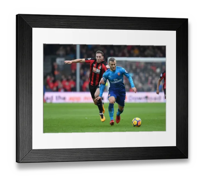 Framed Print : Battle of Midfield: Jack Wilshere vs. Dan Gosling - Premier League Showdown Framed Print : Battle of Midfield: Jack Wilshere vs. Dan Gosling - Premier League Showdown