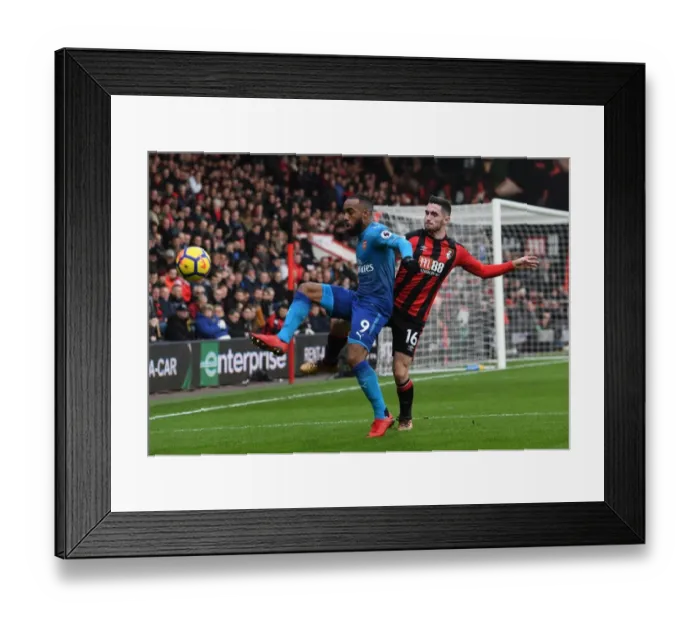 Framed Print : Lacazette vs Cook: Intense Battle in AFC Bournemouth vs Arsenal Premier League Clash