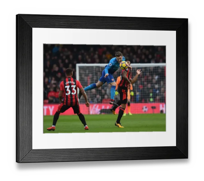 Framed Print : Mustafi vs. Wilson: Heading Battle at Vitality Stadium - AFC Bournemouth vs. Arsenal, Premier League 2017-18