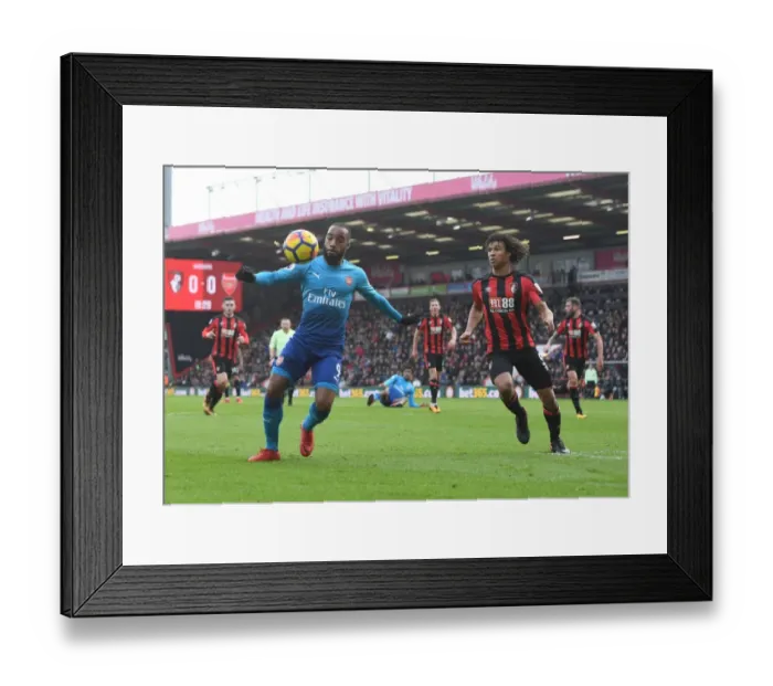 Framed Print : Clash of Forces: Lacazette vs Ake in AFC Bournemouth vs Arsenal Premier League Showdown Framed Print : Clash of Forces: Lacazette vs Ake in AFC Bournemouth vs Arsenal Premier League Showdown
