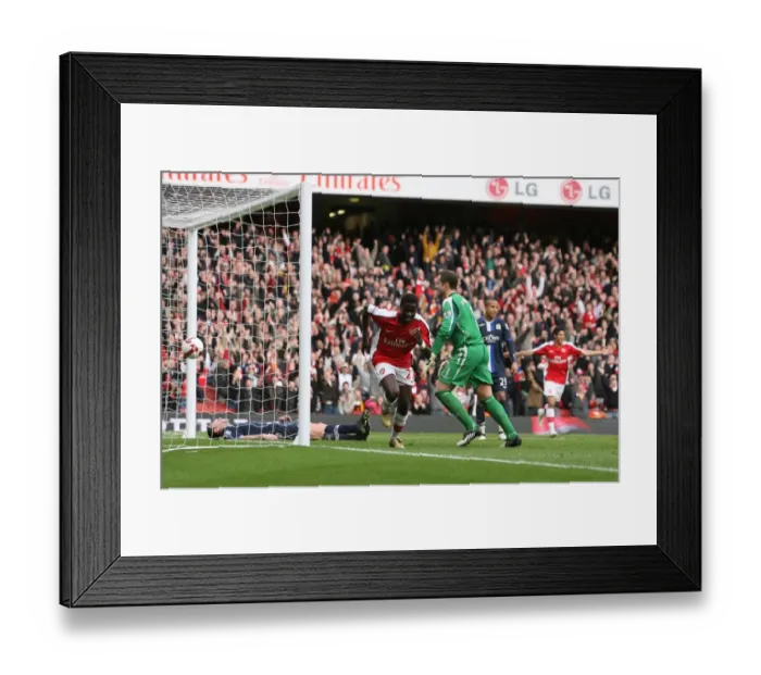 Framed Print : Arsenal's Thrilling 4-0 Victory: Eboue's Triumph at Emirates Stadium Framed Print : Arsenal's Thrilling 4-0 Victory: Eboue's Triumph at Emirates Stadium