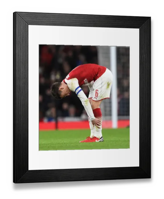 Framed Print : Arsenal's Koscielny Focuses Ahead of Carabao Cup Clash Against Chelsea