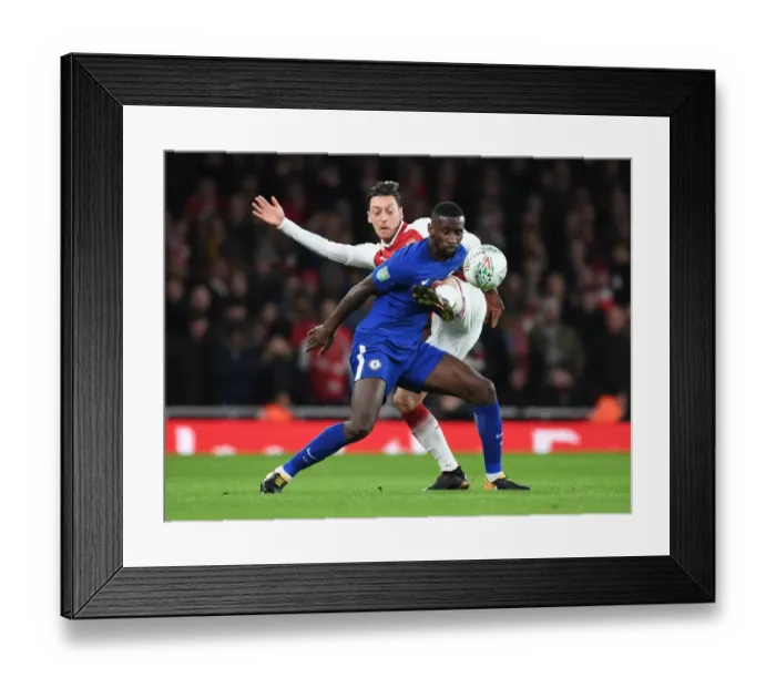 Framed Print : Mesut Ozil vs. Antonio Rudiger: Clash in the Carabao Cup Semi-Final