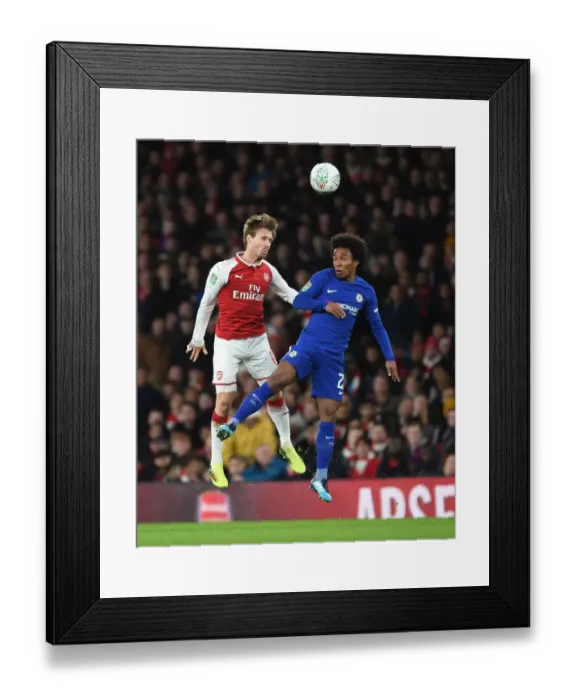 Framed Print : Clash at the Emirates: Monreal vs. Willian in Carabao Cup Semi-Final Showdown
