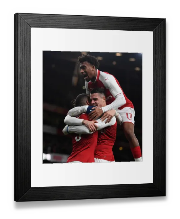 Framed Print : Arsenal Triumph: Xhaka, Lacazette, and Iwobi Celebrate Goals in Carabao Cup Semi-Final vs. Chelsea