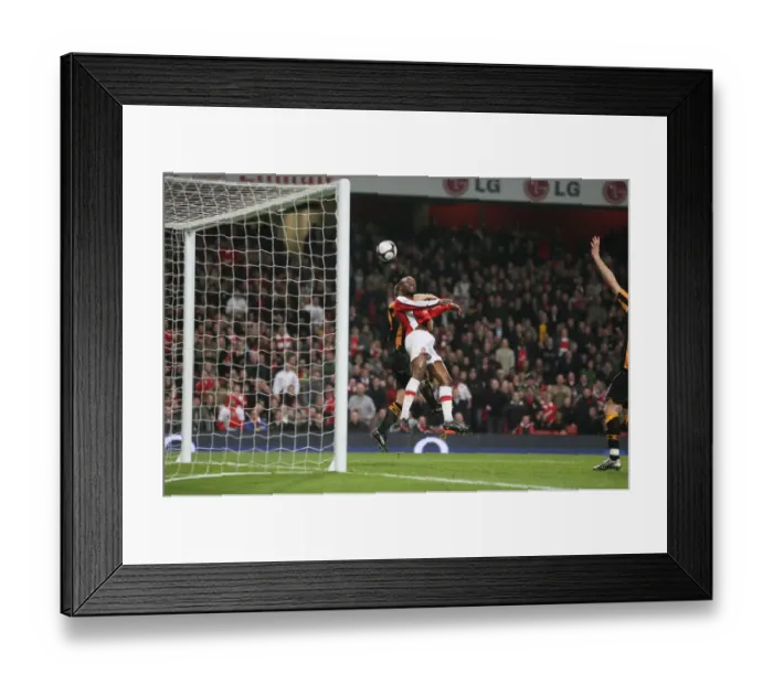 Framed Print : William Gallas heads over Hull City defender Andy Dawson Framed Print : William Gallas heads over Hull City defender Andy Dawson