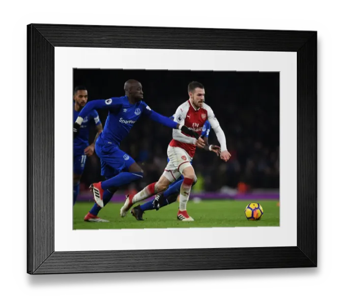 Framed Print : Arsenal's Aaron Ramsey Outmaneuvers Everton's Eliaquim Mangala Framed Print : Arsenal's Aaron Ramsey Outmaneuvers Everton's Eliaquim Mangala