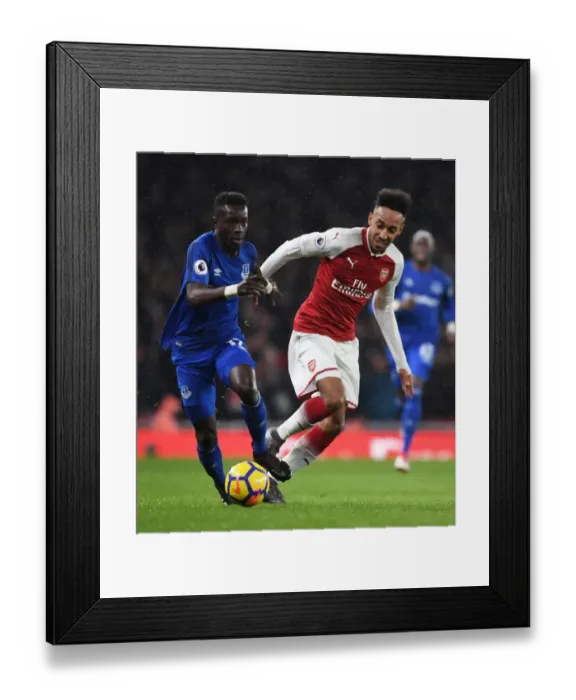 Framed Print : Aubameyang vs. Gueye: Intense Battle in Arsenal's Premier League Showdown