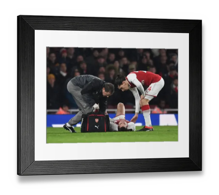 Framed Print : Arsenal: Mkhitaryan Receives Treatment as Bellerin Looks On during Arsenal v Everton, Premier League 2017-18 Framed Print : Arsenal: Mkhitaryan Receives Treatment as Bellerin Looks On during Arsenal v Everton, Premier League 2017-18