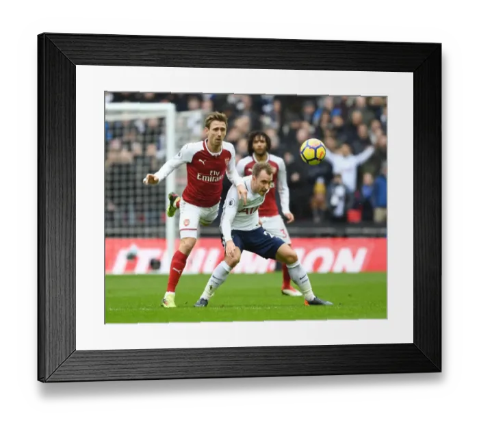 Framed Print : Clash at Wembley: Monreal vs. Eriksen in the Premier League Showdown