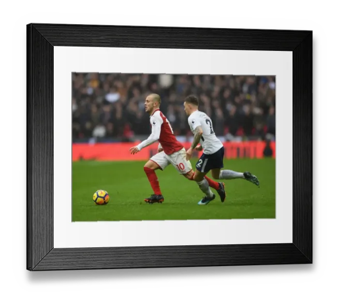Framed Print : Clash of Talents: Wilshere vs. Trippier in Tottenham-Arsenal Showdown