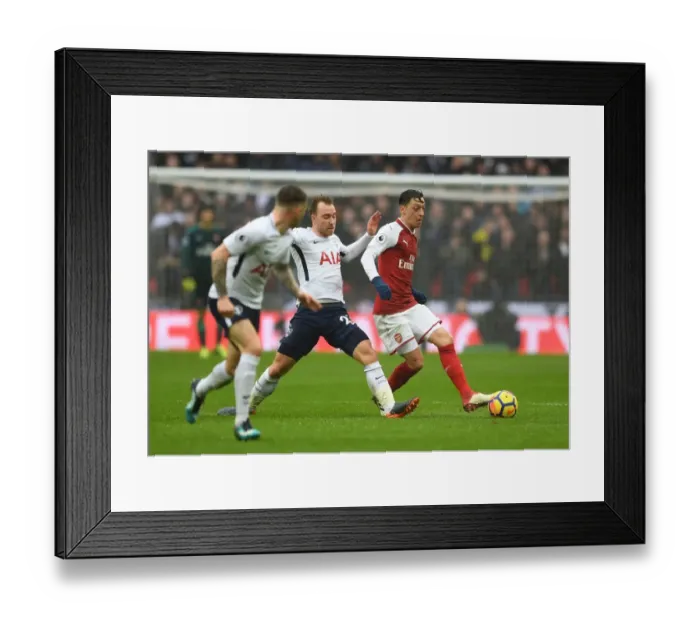Framed Print : Mesut Ozil vs Christian Eriksen: Intense Battle in Tottenham Hotspur vs Arsenal Premier League Clash Framed Print : Mesut Ozil vs Christian Eriksen: Intense Battle in Tottenham Hotspur vs Arsenal Premier League Clash