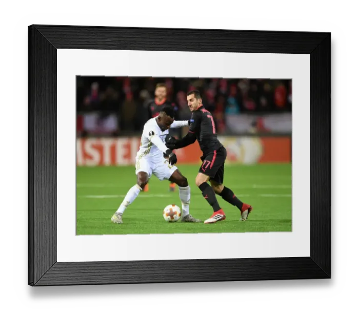 Framed Print : Mkhitaryan vs. Mensah: Arsenal's Europa League Battle in Ostersund Framed Print : Mkhitaryan vs. Mensah: Arsenal's Europa League Battle in Ostersund