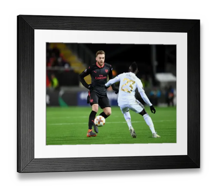 Framed Print : Calum Chambers vs. Samuel Mensah: Clash in the Europa League between Ostersunds and Arsenal Framed Print : Calum Chambers vs. Samuel Mensah: Clash in the Europa League between Ostersunds and Arsenal