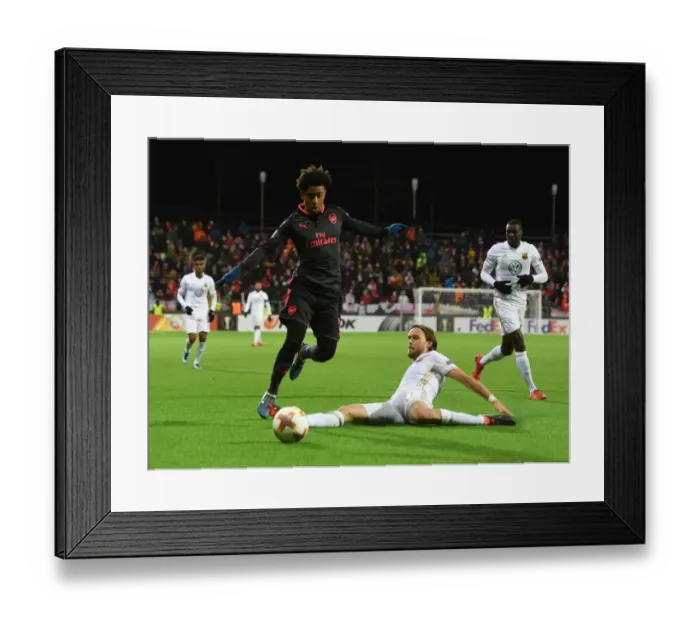 Framed Print : Reiss Nelson vs Tom Pettersson: Clash in the Europa League between Ostersunds and Arsenal Framed Print : Reiss Nelson vs Tom Pettersson: Clash in the Europa League between Ostersunds and Arsenal