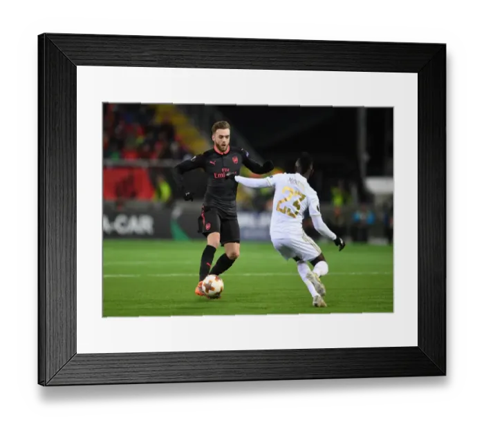 Framed Print : Calum Chambers Outmaneuvers Samuel Mensah in Arsenal's Europa League Clash vs Ostersunds Framed Print : Calum Chambers Outmaneuvers Samuel Mensah in Arsenal's Europa League Clash vs Ostersunds