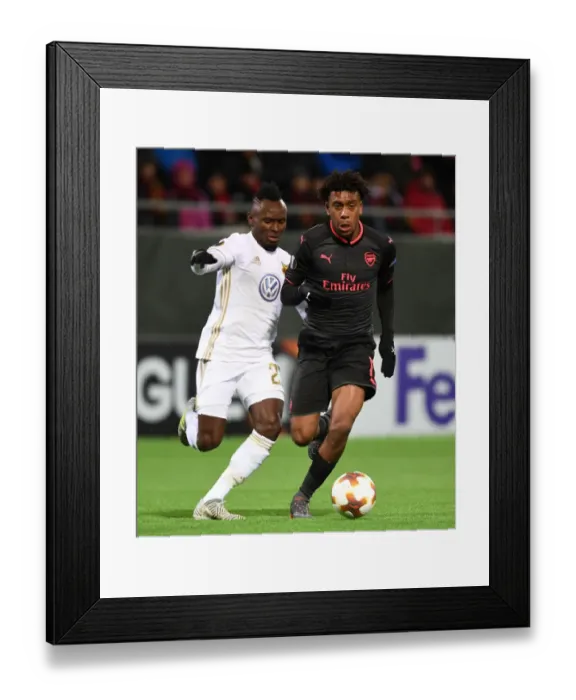 Framed Print : Alex Iwobi vs. Samuel Mensah: Clash in the Europa League between Ostersunds and Arsenal
