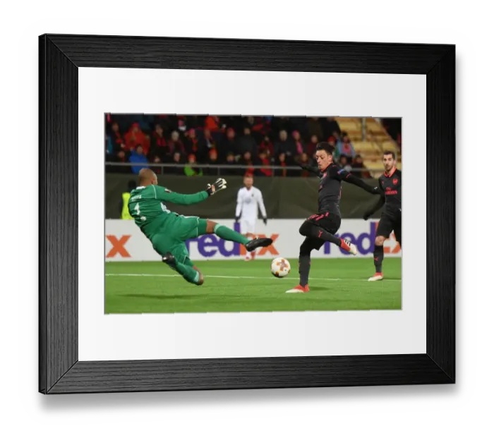 Framed Print : Mesut Ozil's Shot Saved by Aly Keita in Ostersunds vs Arsenal UEFA Europa League Match