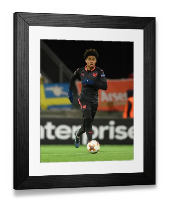 Framed Print : Reiss Nelson: Arsenal's Rising Star Dazzles in Europa League Showdown against Ostersunds FK