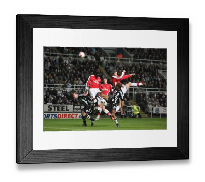 Framed Print : Nicklas Bendtner heads over Newcastle goalkeeper Steve Framed Print : Nicklas Bendtner heads over Newcastle goalkeeper Steve