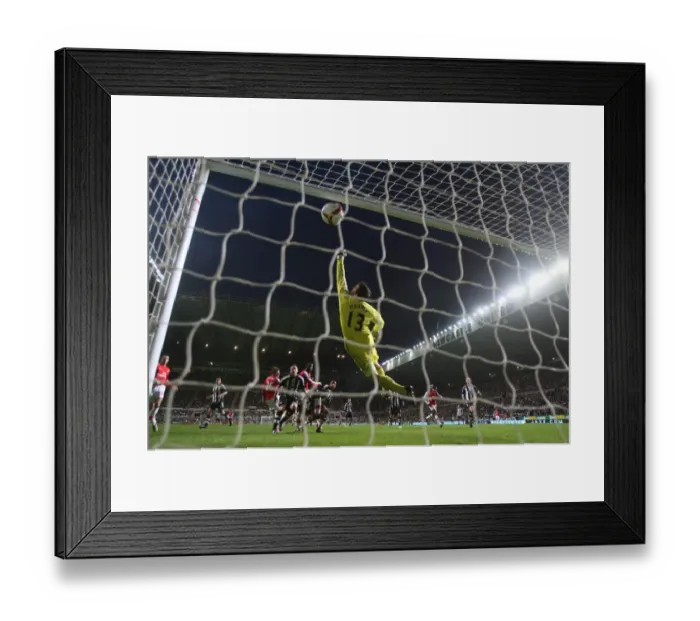 Framed Print : Bendtner's Thrilling Header: Arsenal Takes the Lead Over Newcastle (3:1)