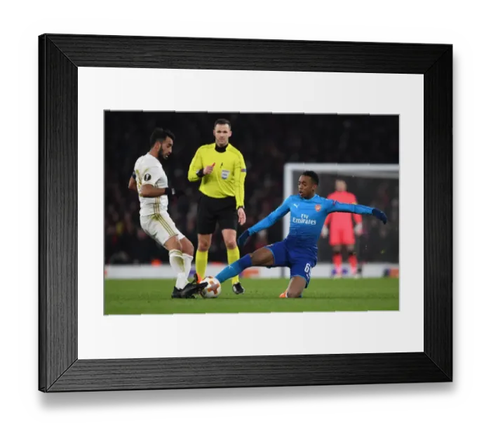 Framed Print : Arsenal's Joe Willock Faces Off Against Östersunds Saman Ghoddos in Europa League Clash Framed Print : Arsenal's Joe Willock Faces Off Against Östersunds Saman Ghoddos in Europa League Clash
