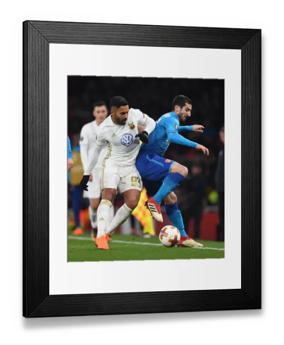 Framed Print : Mkhitaryan vs. Ghoddos: Intense Clash in Arsenal's Europa League Battle Against Östersunds FK Framed Print : Mkhitaryan vs. Ghoddos: Intense Clash in Arsenal's Europa League Battle Against Östersunds FK