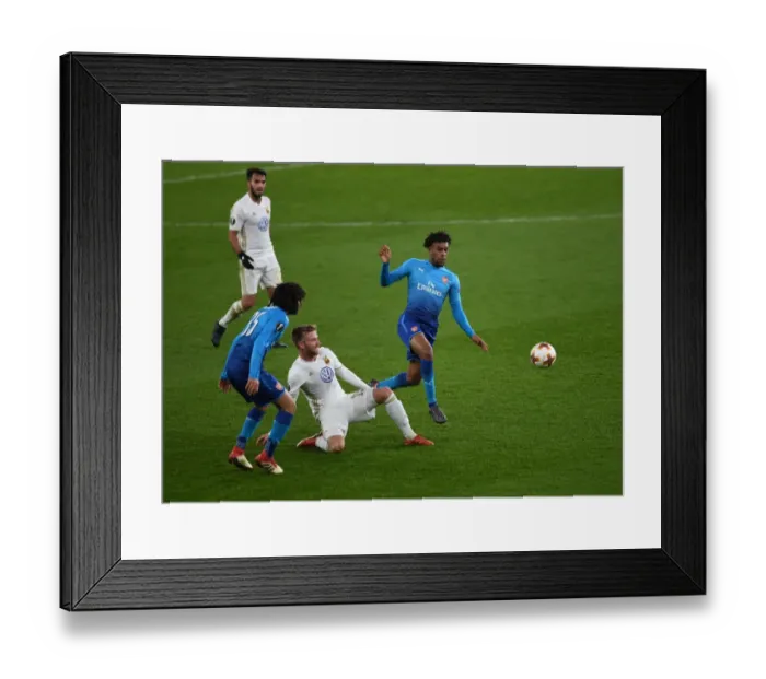 Framed Print : Arsenal's Alex Iwobi Faces Off Against Östersunds Dennis Widgren in Europa League Clash Framed Print : Arsenal's Alex Iwobi Faces Off Against Östersunds Dennis Widgren in Europa League Clash