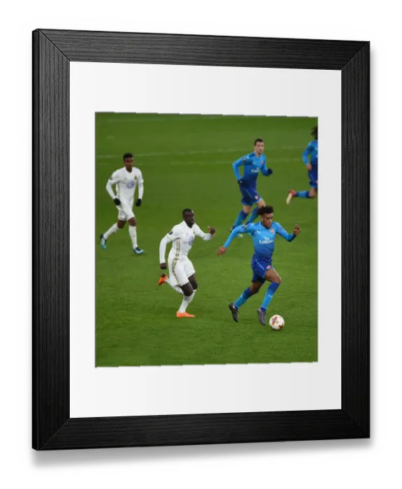 Framed Print : Arsenal's Alex Iwobi Faces Off Against Östersunds Ken Sema in Europa League Clash Framed Print : Arsenal's Alex Iwobi Faces Off Against Östersunds Ken Sema in Europa League Clash